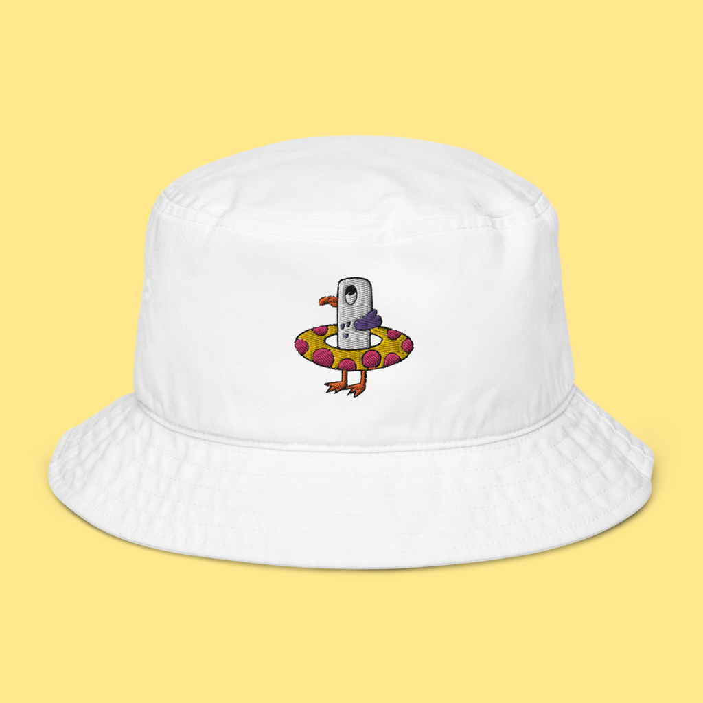 Seagull Steve 100% organic cotton bucket hat in white. Seagull Steve is embroidered on the hat in purple/grey, pink, white, yellow, orange and black. Seagull Steve is on the front of the hat in the middle.