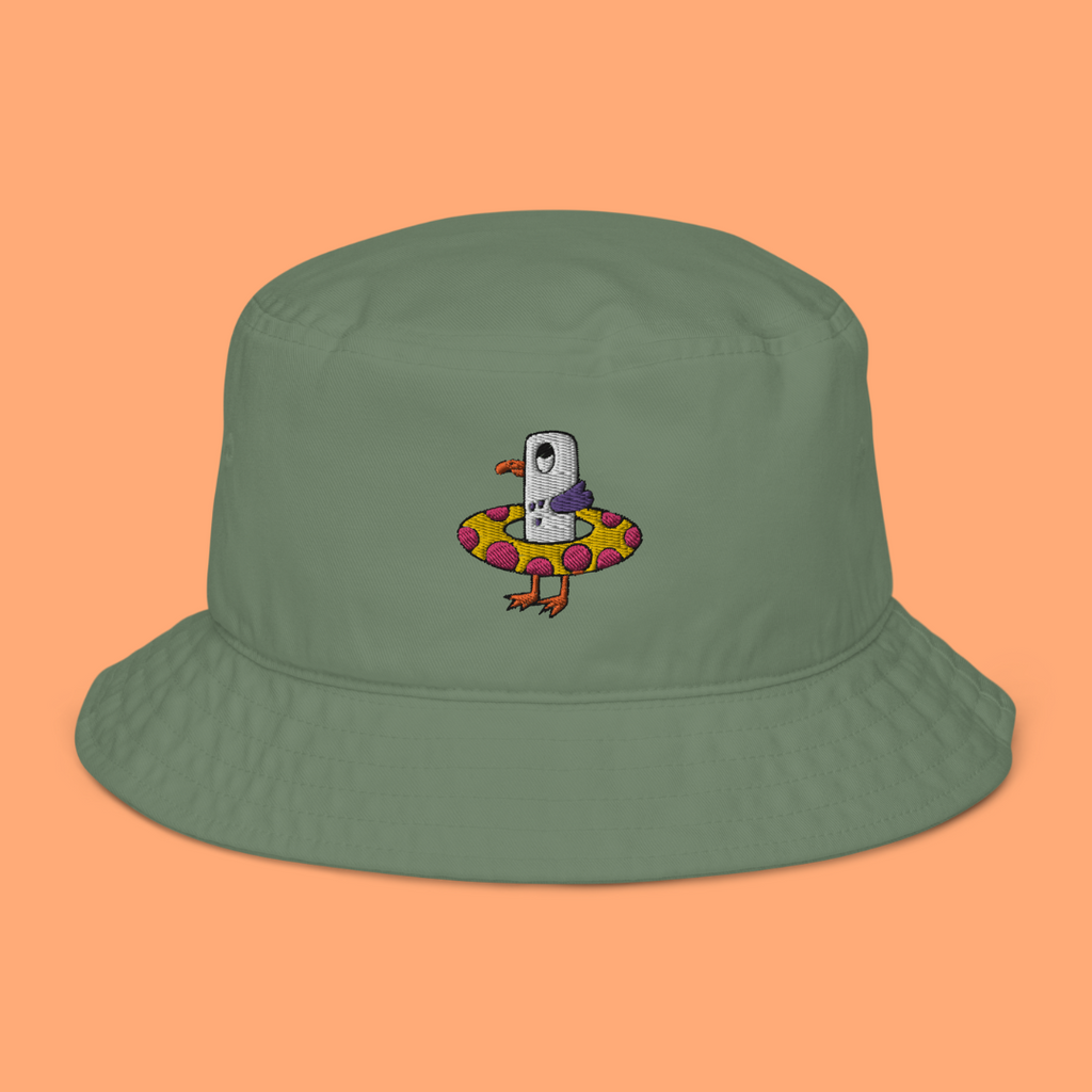 Seagull Steve 100% organic cotton bucket hat in dill green. Seagull Steve is embroidered on the hat in purple/grey, pink, white, yellow, orange and black. Seagull Steve is on the front of the hat in the middle.