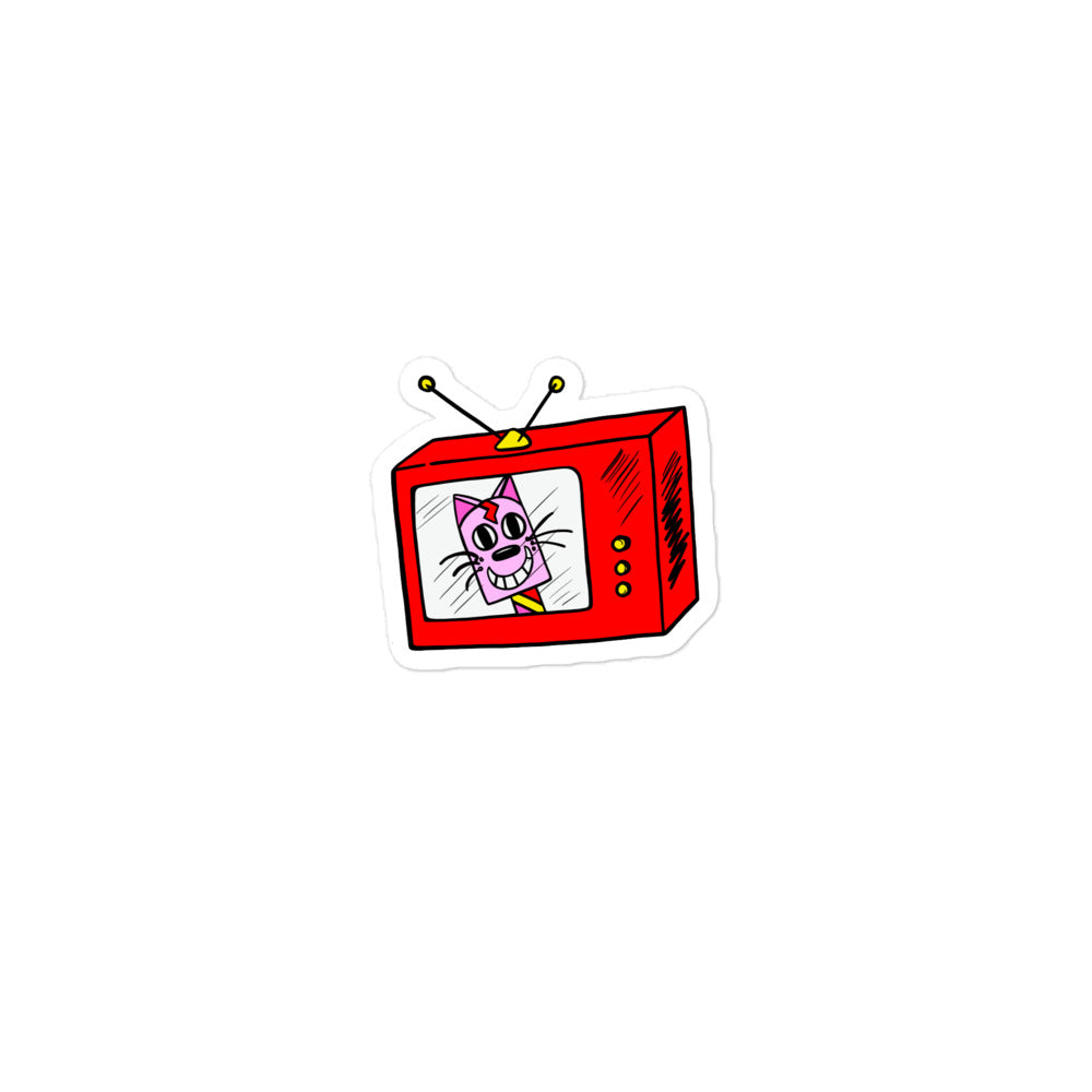 Retro Cat TV tiny vinyl sticker. A pink ice-cream cat inside a red square shaped tv. The red TV has yellow buttons and yellow aerial on the top. The retro pink cat has a big smile and a multi-coloured lolly stick. Very bright. The vinyl sticker is also water resistant.