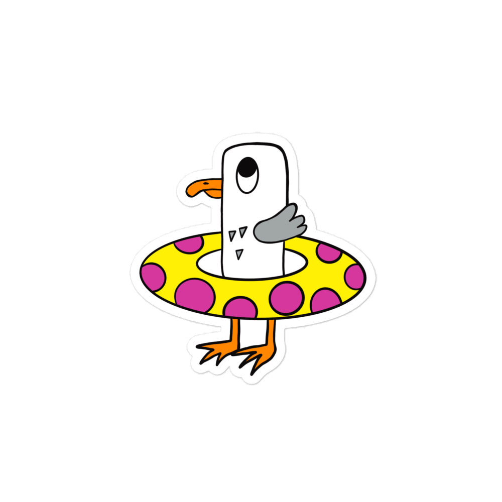 Seagull Steve vinyl, water resistant small sticker. Here he can be seen with his bright yellow rubber ring with bright pink circles. Seagull Steve is white and grey with an orange beak and orange feet. He has big wide eyes.